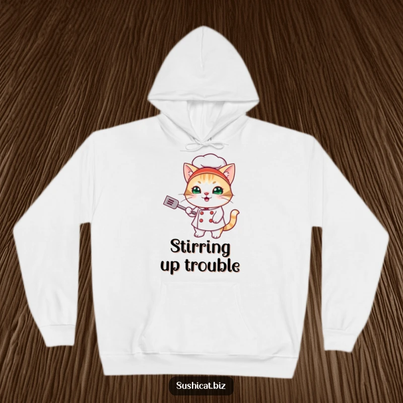 Funny hoodie featuring a mischievous cat in a sushi chef outfit, energetically flipping a tiny spatula, radiating playful energy.